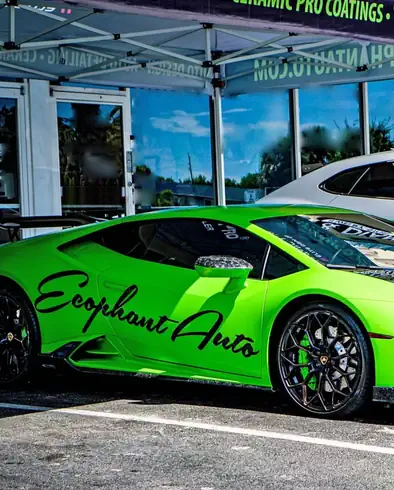 Green Lamborghini Huracan with Ecophant Auto livery in Boca Raton, Florida